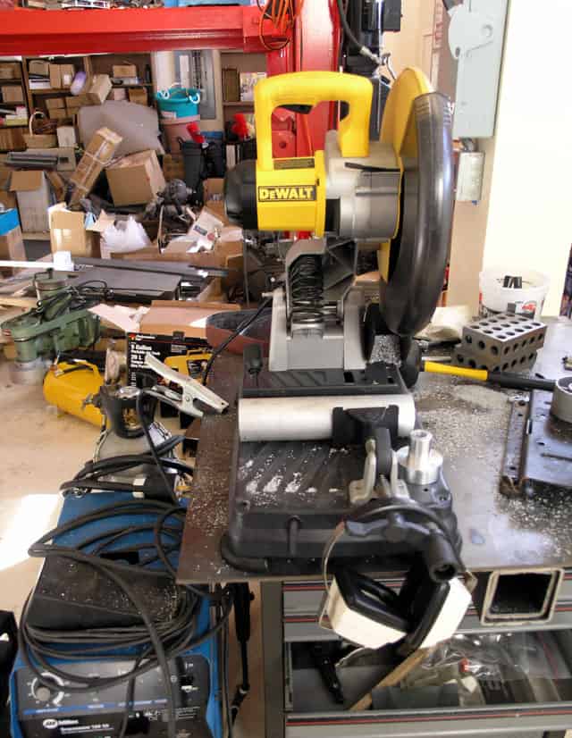 Cluttered workshop with tools and equipment.