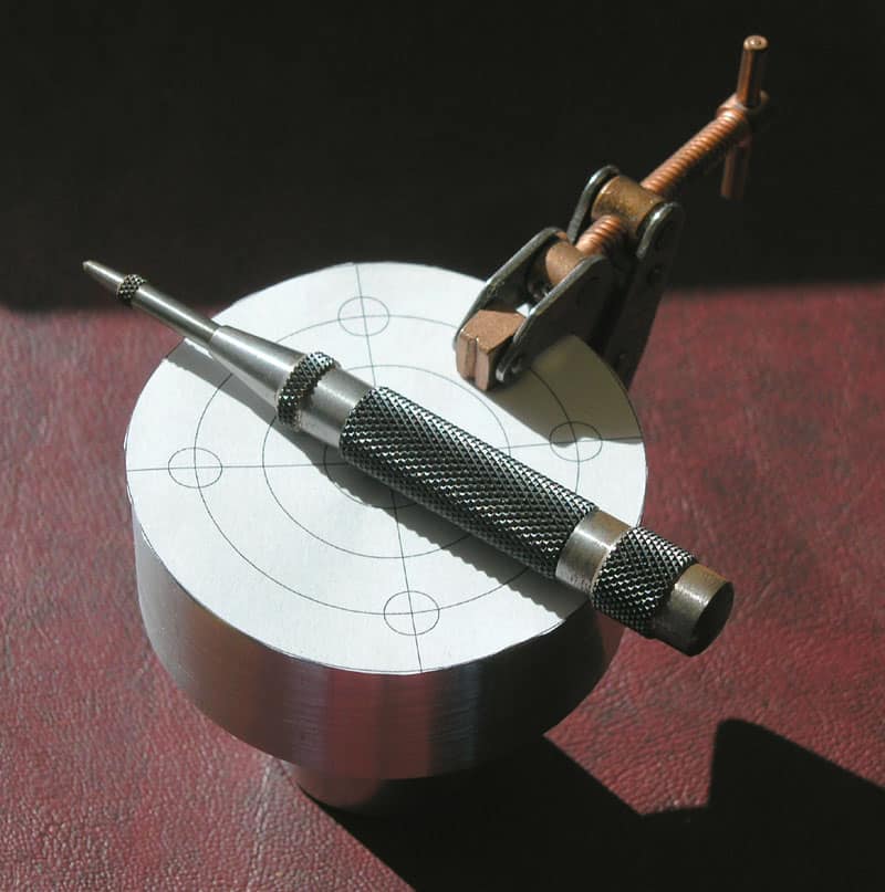 Metalworking tool with long handle and pointed tip.