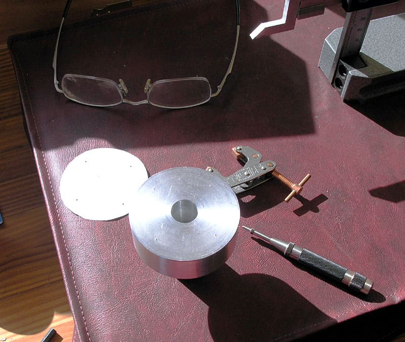 Machining tools and equipment on a table.