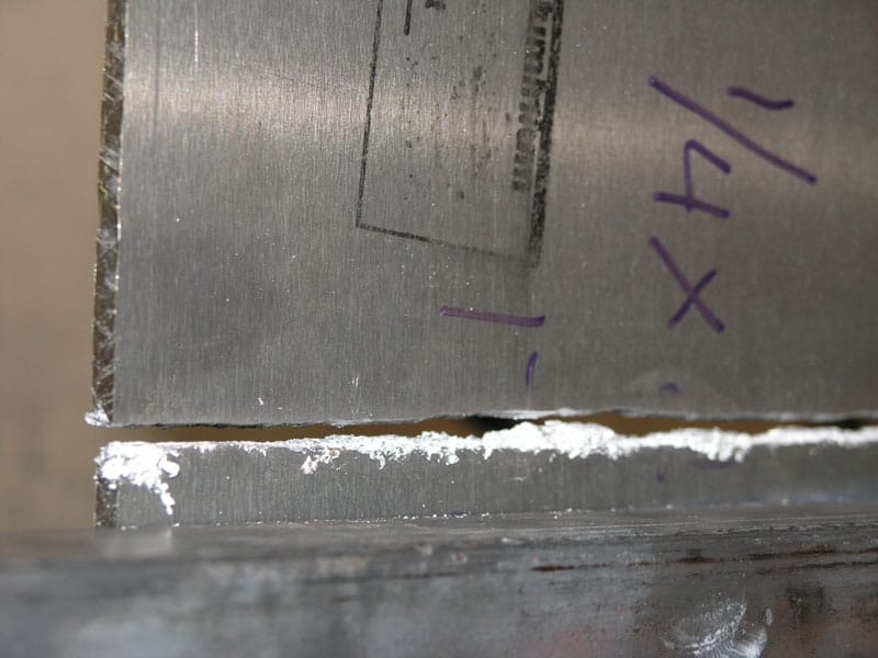 Metal surface with visible wear and tear.