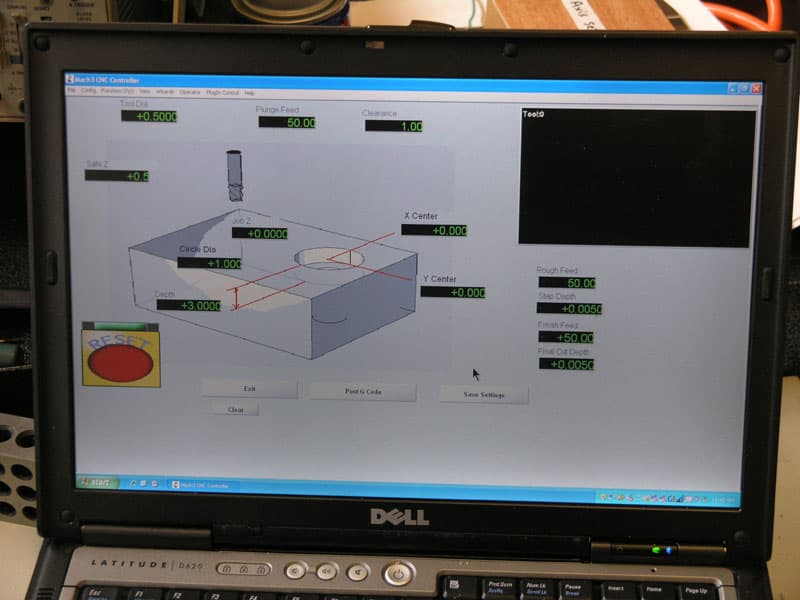 Computer screen displaying a 3D model of a machine part with measurement tools.