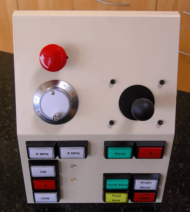 Manufacturing control panel with buttons and dials.