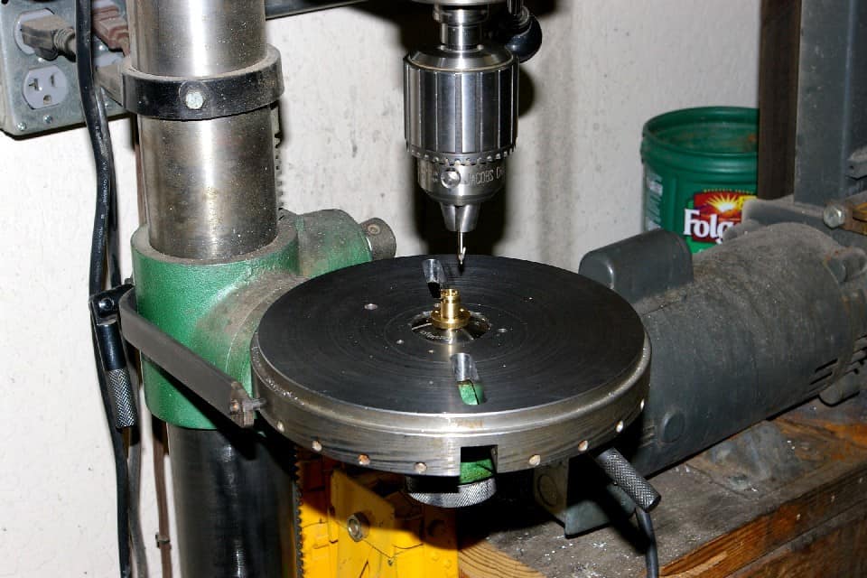 Metalworking drill press with detailed components and precise engineering.