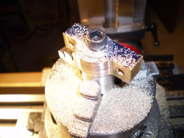 Bearing being machined on a lathe, precision components in process.