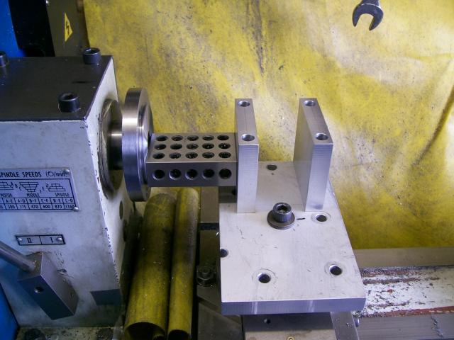 Metalworking machine spindle speed control unit with white metal box, black text and dials, and silver plate.