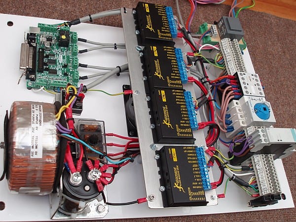 Electronic circuit board with complex network of connections and various components.