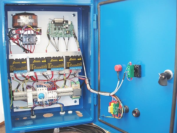 Blue electrical box interior with wires and circuit boards.