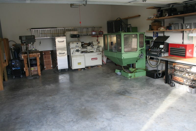 Well-organized home workshop with machinery and tools.