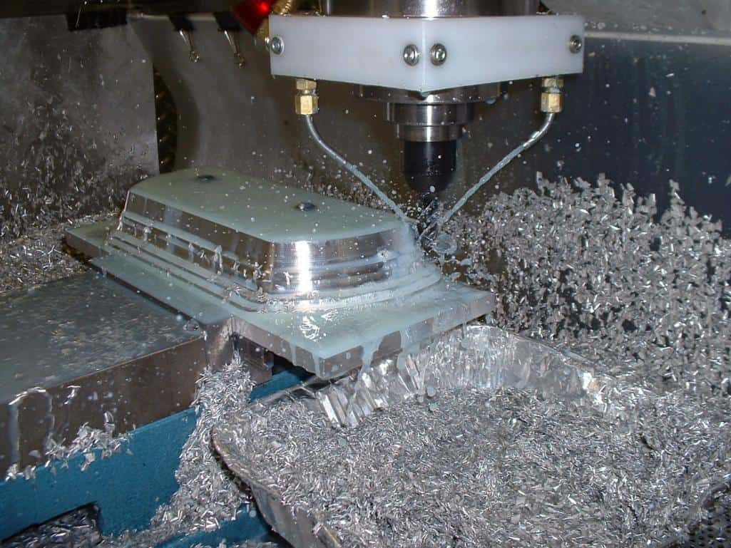 Machining operation with intricate metal fabrication details.