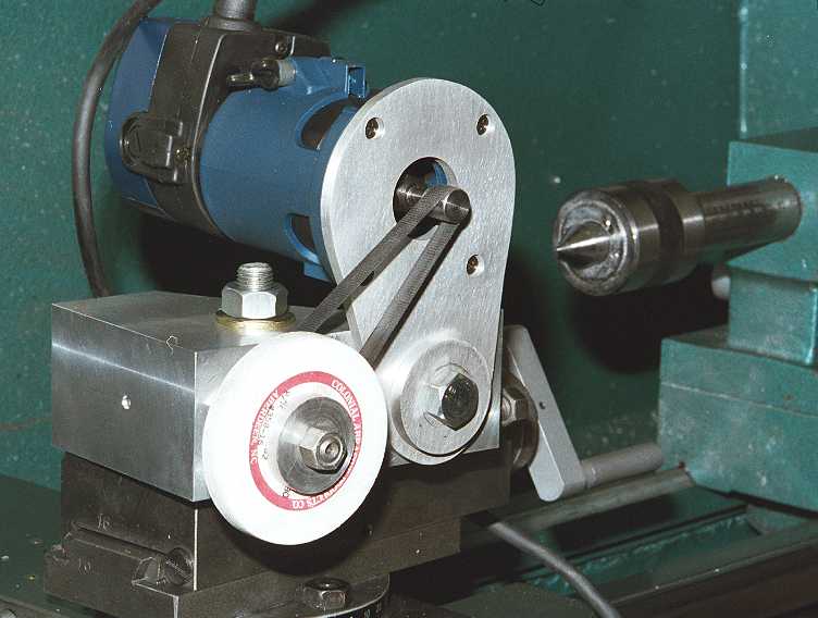 Router grinder with blue motor housing, silver metal base plate and white wheel with red stripe.