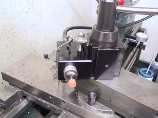 Metalworking tool with black base and silver components.