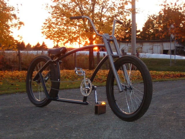 Bicycle with unusual frame design outdoors.