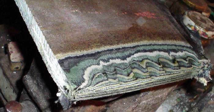 Worn piece of wood with rough surface.