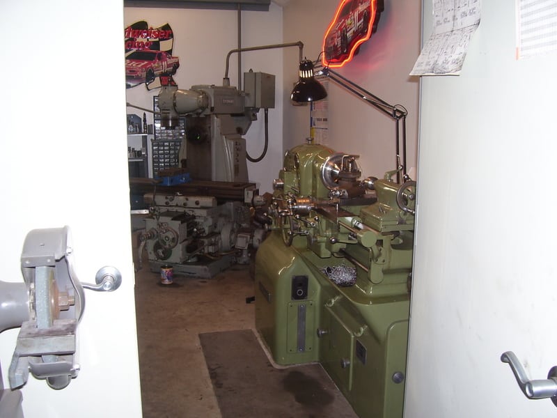 Well-equipped machine shop with lathes, mills, and grinders.