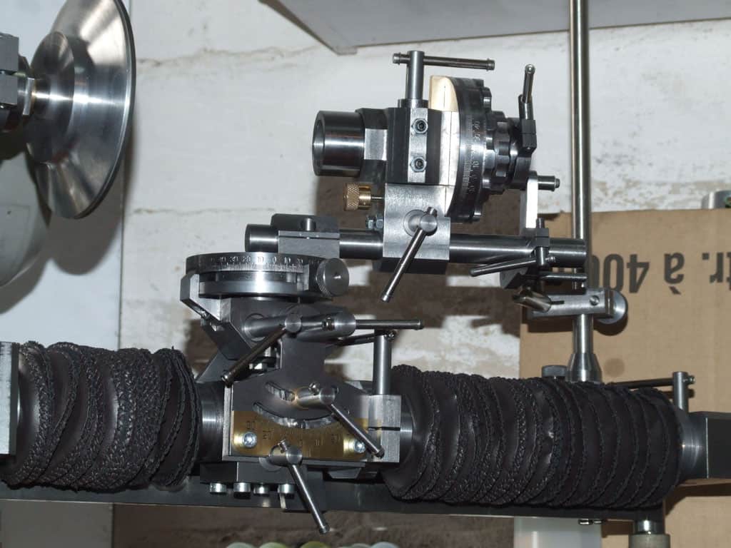 Industrial machinery with black cable and metal components.