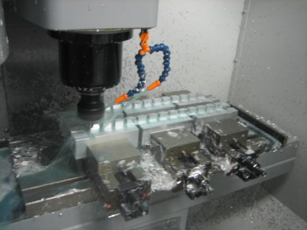 Milling machine with two vises attached.