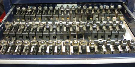 Close-up of a tool holder with multiple slots.