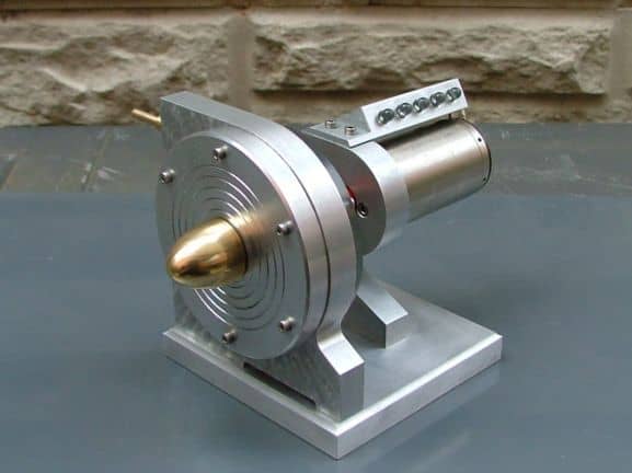 Small metallic device with gold-colored tip.