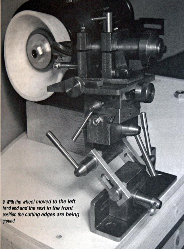 Industrial machine with tools and parts in a manufacturing setting.