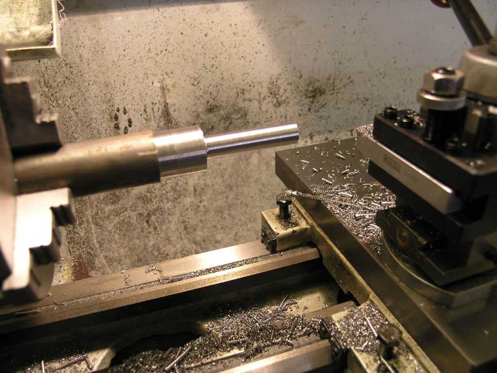 Lathe in a well-lit workshop.