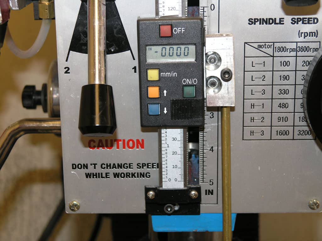 A control panel with digital readout displaying "0.000" in blue text.