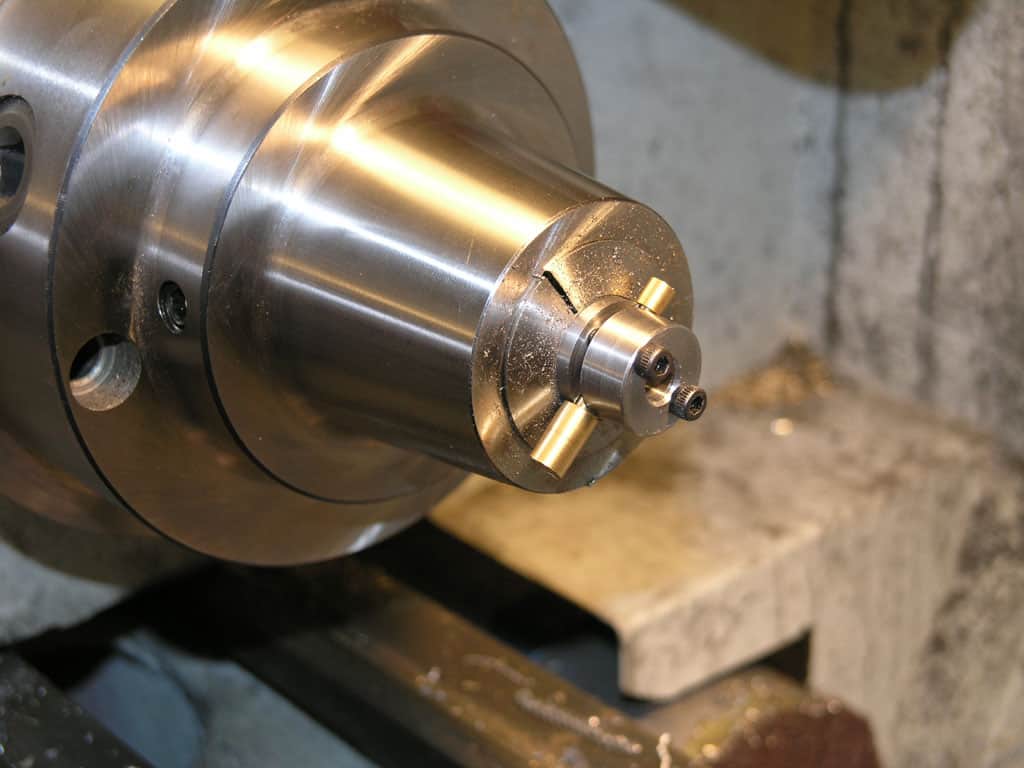 Metal component with threaded shaft.