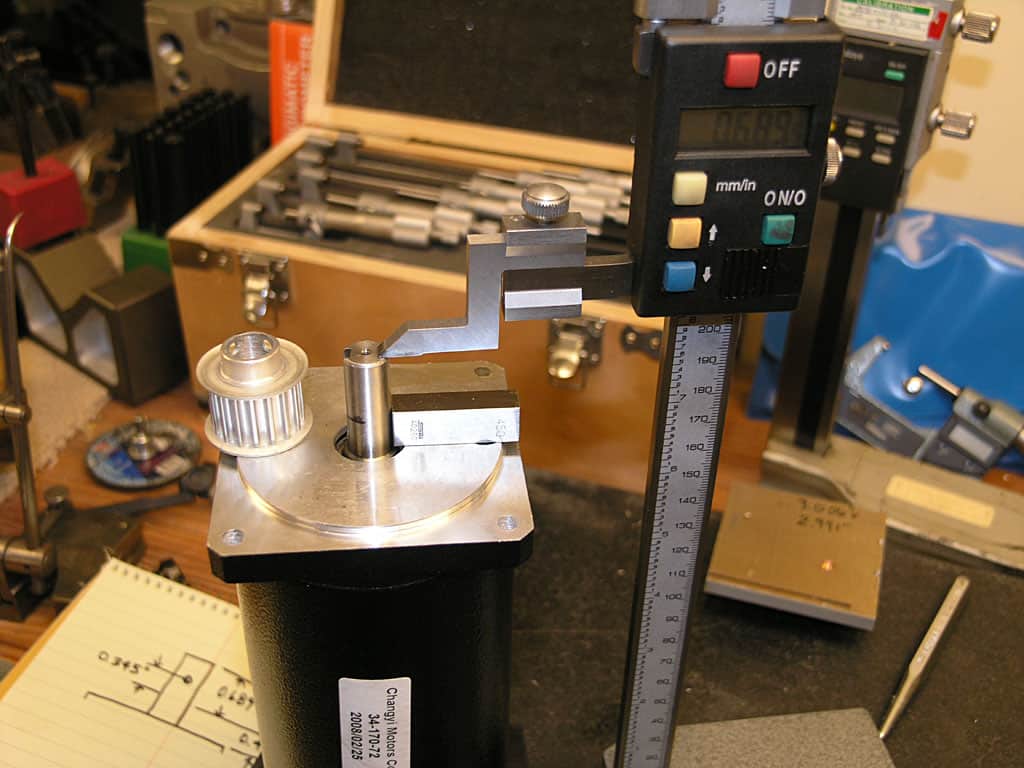 Micrometer caliper in a workshop setting.