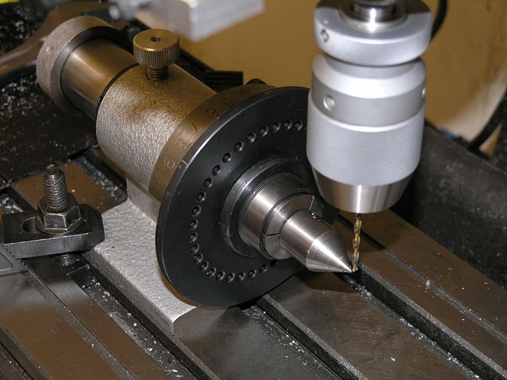 Metalworking lathe tool with a drill bit attached.