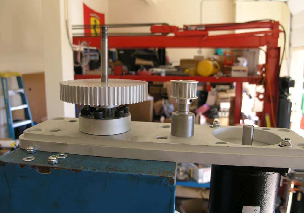 Metal components with gears and mechanical parts in an industrial setting.