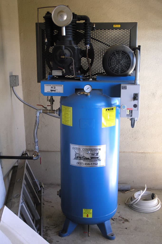 An air compressor with an Eaton Compressor tank and equipment.