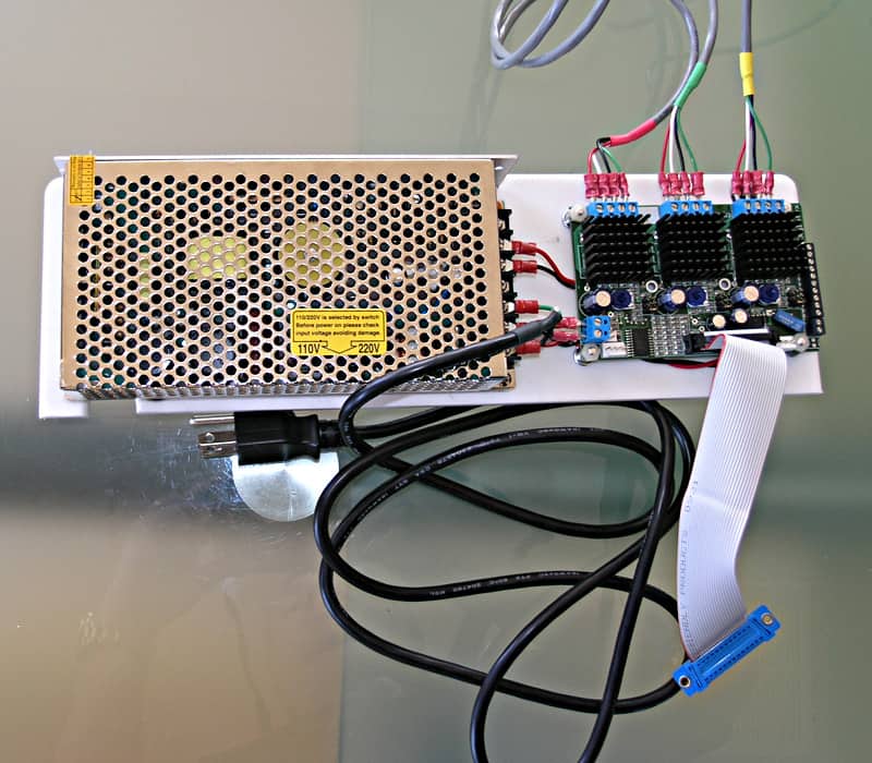 White power supply unit with metal grate, wires, and cables.