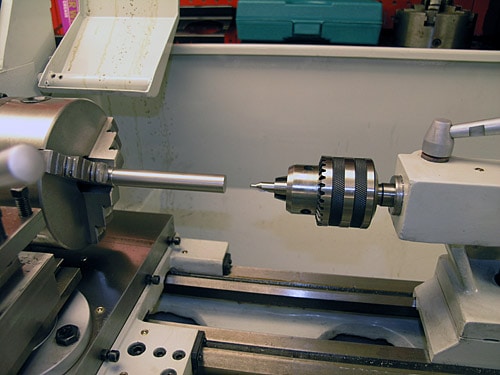 Metalworking lathe in a workshop.