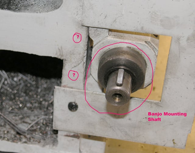 Close-up view of white metal surface featuring Banjo Mounting Shaft.