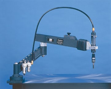 A photograph of a tapping arm with a rotating cutting tool for creating internal threads.