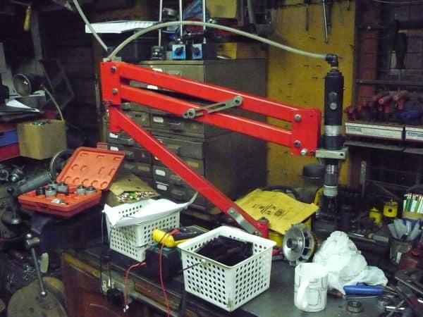 Red tapping head for metal threading operations.