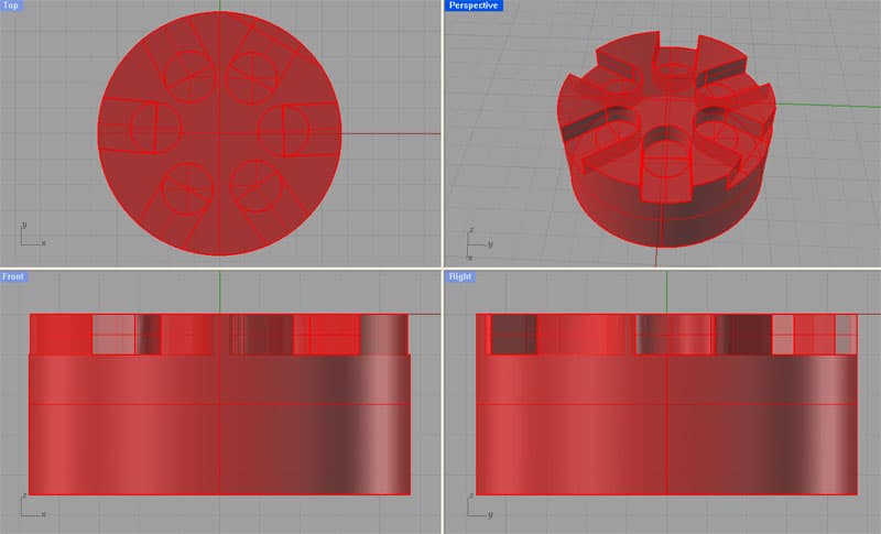 3D CAD model of an engine block with pockets, rendered in red.