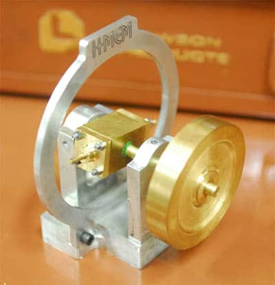 Precision rotary axis component with metallic structure and rotating shaft.