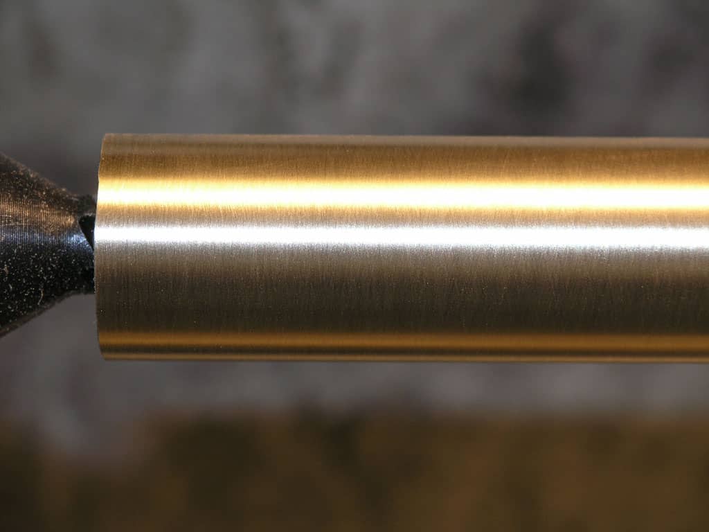 Brass cylindrical metal stock with smooth surface.