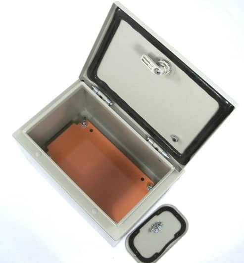 Metal box with open lid, orange interior and small round handle.