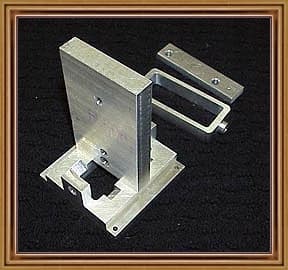 Metal fixture holding an engineering block.