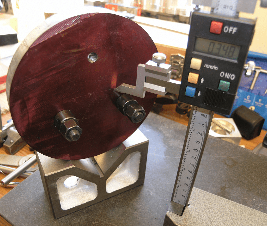 Precision measuring tool with digital display and long arm.