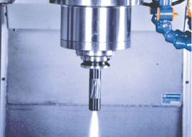 Metal nozzle with small opening emitting bright white light.