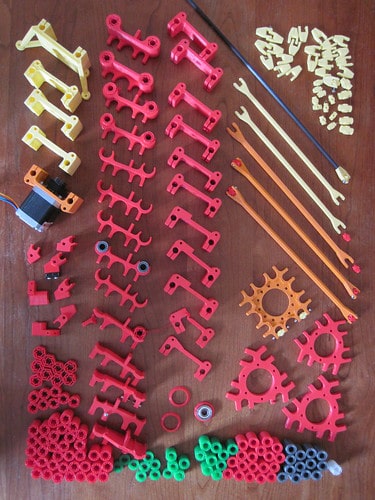 Various plastic and rubber parts, including gears, axles, and bushings.