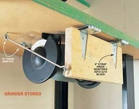 Storage block with long object clamps.