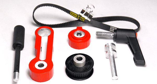 Tools and parts, including threaded components, cord, and metal pieces, on a white background.