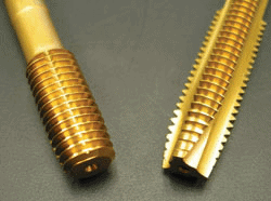 Gold-colored threaded objects with a ribbed surface.
