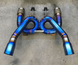 Blue metal exhaust system components with metal pipes and a central hole.