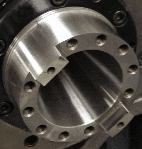 Metallic object with circular holes.