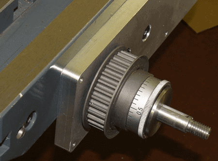 Metal component with knurled knob and adjustable screw.