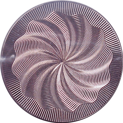 Circular object with a spiral pattern of lines.